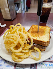 Burger On Texas Toast And Onion Rings