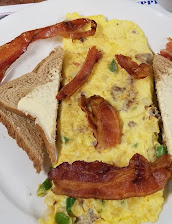 3 French Toast 2 Eggs 2 Strips Of Bacon And 2 Sausage